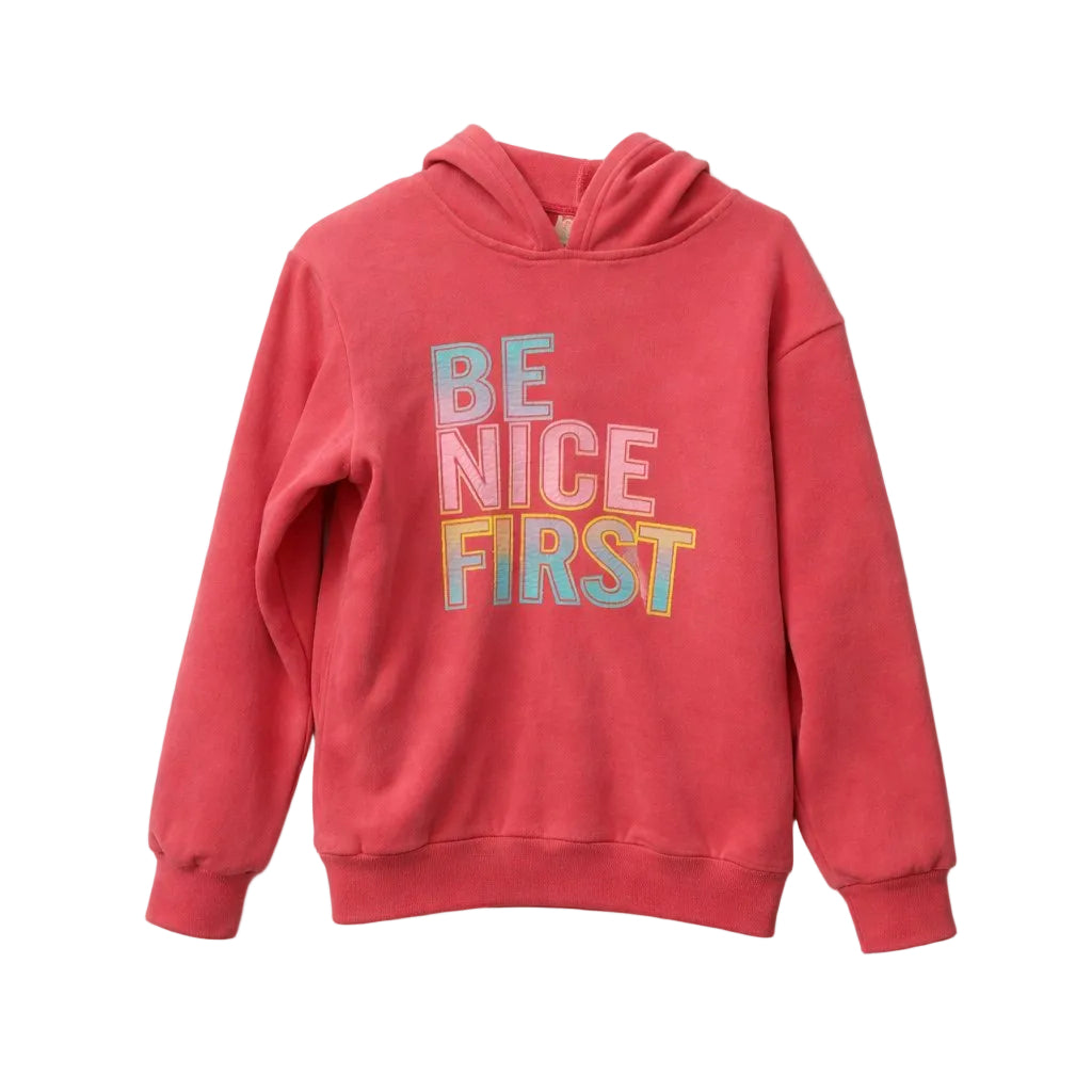 Red hoodie with 'Be Nice First' text on a white background