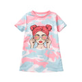 Dress with a colorful design of a woman with a headband and sunglasses on a white background