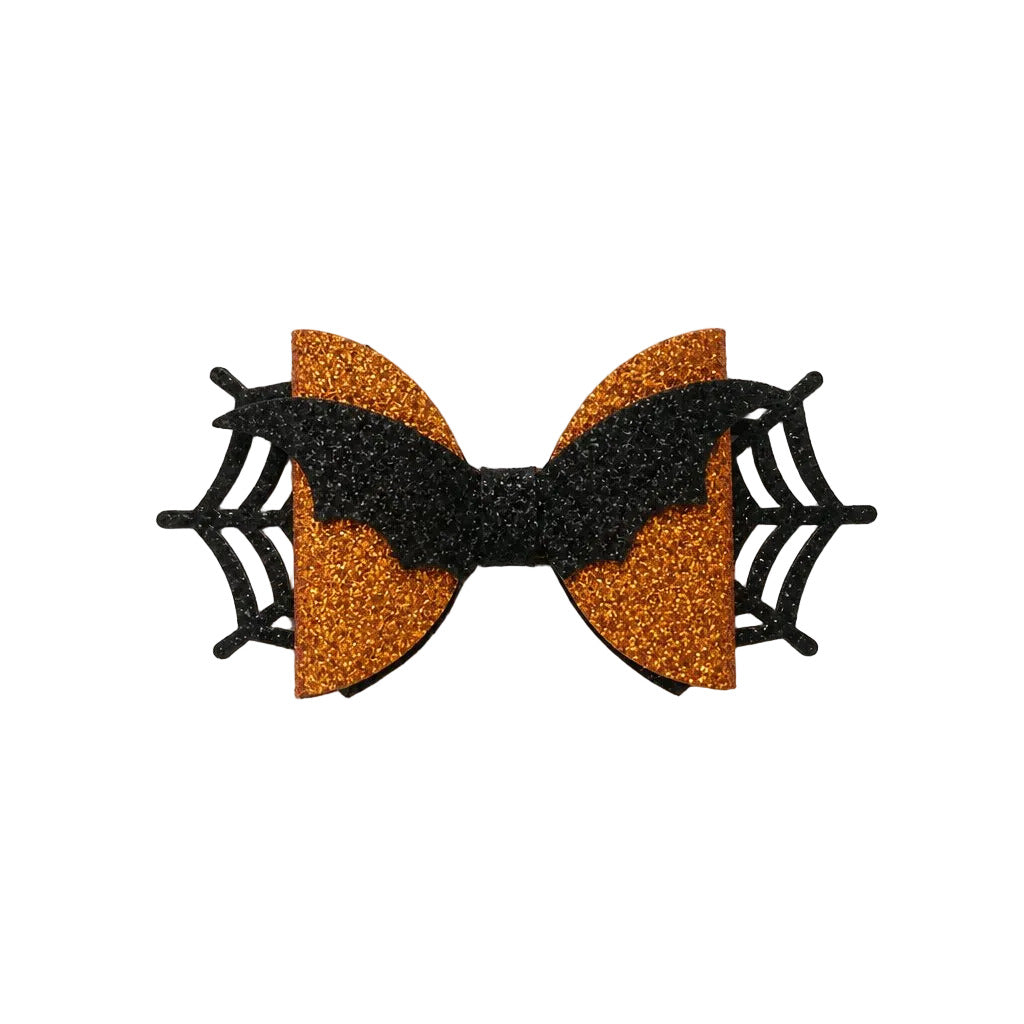 Halloween-themed bow with orange and black glitter on a light gray background