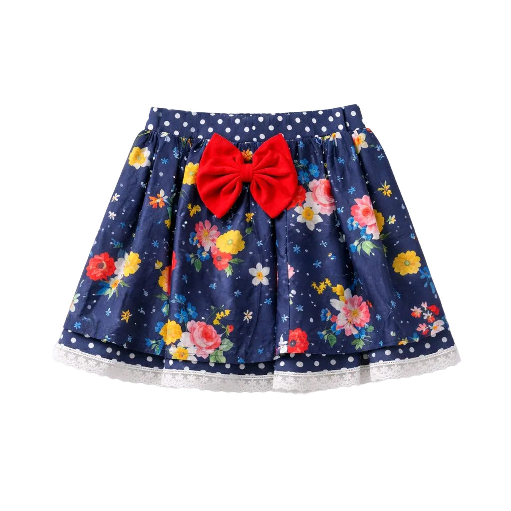 Navy floral skirt with a red bow on a white background
