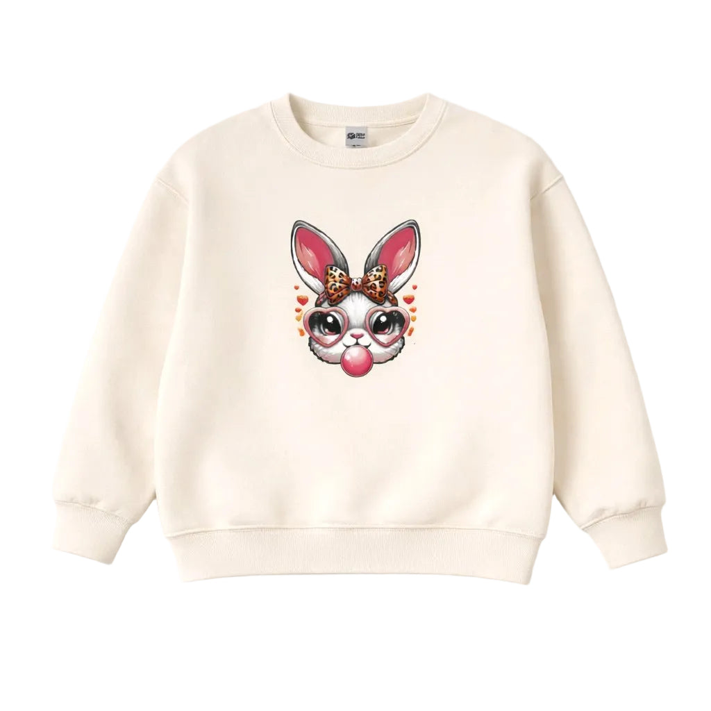 Beige sweatshirt with a cartoon bunny face design on a white background