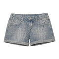 Light blue denim shorts on a gray background